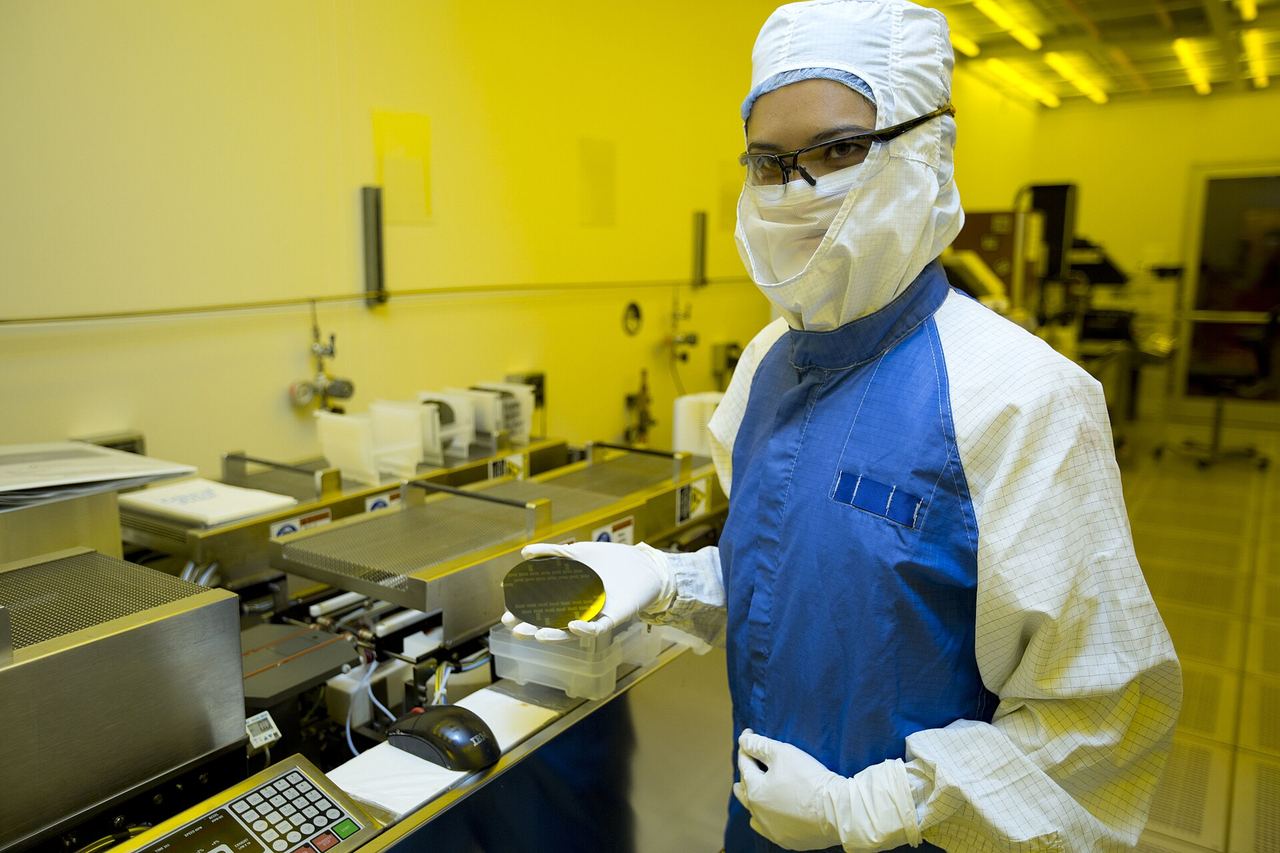 A researcher holding a silicon wafer
